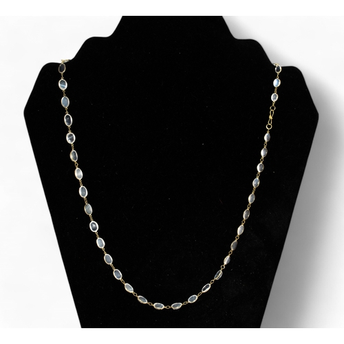 137 - ContinentalA moonstone and 14 carat spectacle set necklaceLength: 58cm... 