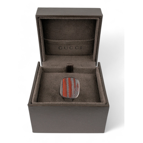 146 - Tom Ford for GucciAn 18 carat blackened gold and striated jasper dress ring. With original Gucci box... 