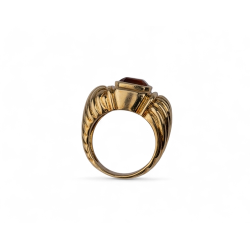 150 - David Yurman, AmericanA Madeira citrine and 18 carat gold dress ring, the rectangular citrine collet... 