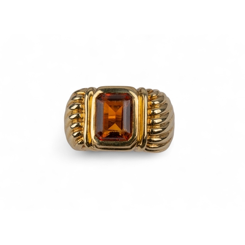 150 - David Yurman, AmericanA Madeira citrine and 18 carat gold dress ring, the rectangular citrine collet... 