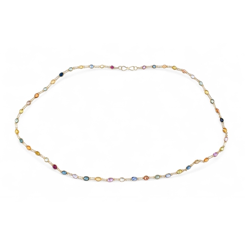 154 - Continental, contemporaryA multicoloured sapphire and 14 carat gold spectacle set long chainLength: ... 