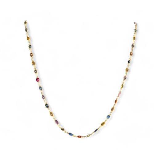 154 - Continental, contemporaryA multicoloured sapphire and 14 carat gold spectacle set long chainLength: ... 