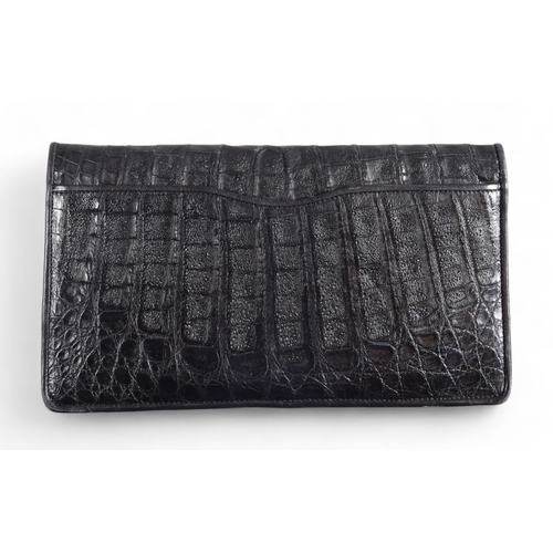 170 - Donna Karen New YorkA black crocodile skin clutch pursec. 1980sDimensions:6 in. (H) x 10.75 in. (W) ... 