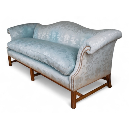 172 - A George III style camelback sofa Straight backed, upholstered in pale blue silk, with mahogany legs... 