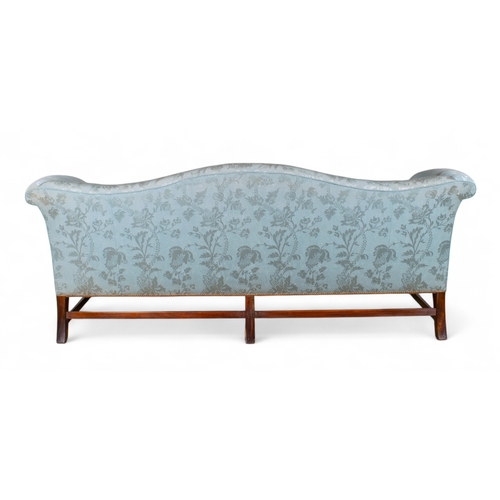 172 - A George III style camelback sofa Straight backed, upholstered in pale blue silk, with mahogany legs... 