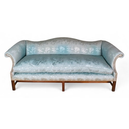 172 - A George III style camelback sofa Straight backed, upholstered in pale blue silk, with mahogany legs... 