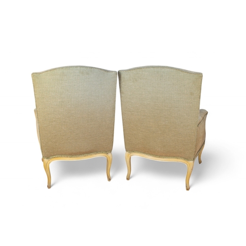 193 - French18th/19th CenturyA pair of upholstered fauteuilsOn cabriole legs, with textured modern upholst... 