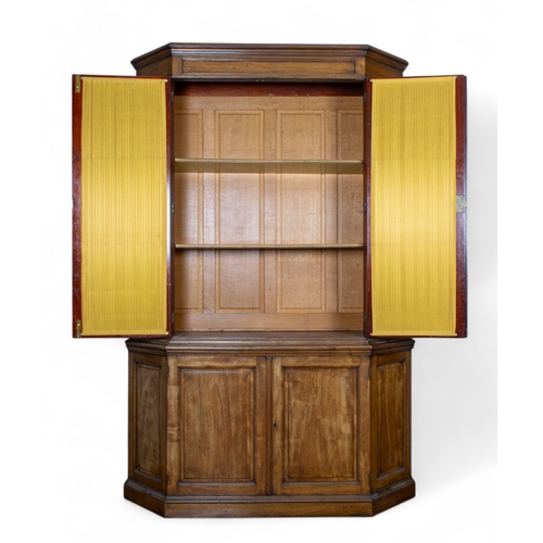 224 - EnglishCirca 1830A mahogany breakfront bookshelfThe bevelled glass front with pleated fabric withinP... 