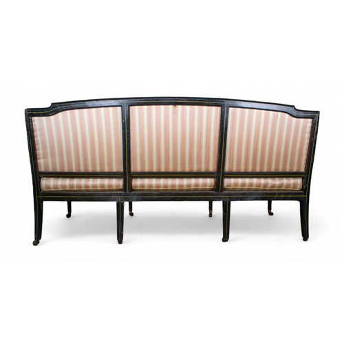 225 - English, RegencyAn ebonised gilt-wood three seater sofa, with soft pink striped silk upholsteryPrope... 