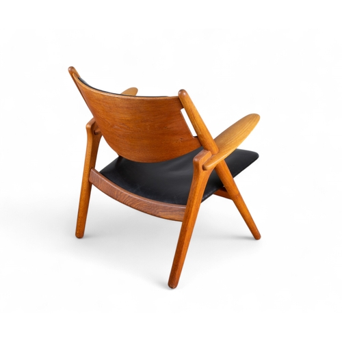 232 - Circa 1950s, Hans Wegner for Carl Hansen & SonA sawbuck chair model CH28Oak and black leatherDim... 