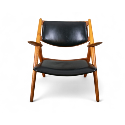 232 - Circa 1950s, Hans Wegner for Carl Hansen & SonA sawbuck chair model CH28Oak and black leatherDim... 