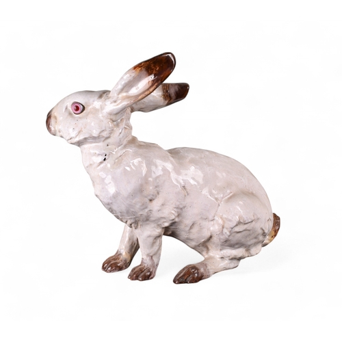 315 - J Filmont Caen Normandy, FranceA white ceramic rabbit, with inset pink glass eyesSigned 'J Filmont C... 