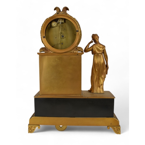 330 - French EmpireAn ormolu clock with a figure in classical Greek dress and library booksProperty of a&n... 