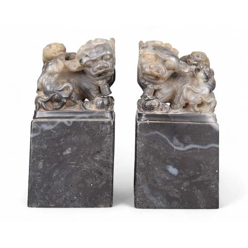 337 - Chinese19th CenturyPair of soapstone foo dogsProperty of a gentlemanFrom the collection of Peter Roe... 