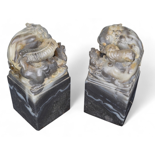 337 - Chinese19th CenturyPair of soapstone foo dogsProperty of a gentlemanFrom the collection of Peter Roe... 