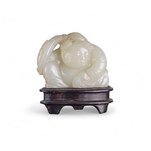 340 - Chinese19th CenturyWhitish mutton fat jade boy and carpProperty of a gentlemanFrom the collection of... 