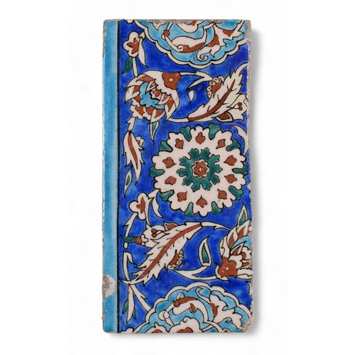 360 - 17th centuryAn Iznik pottery tileOf a rectangular form, decorated on a cobalt-blue ground with a flo... 