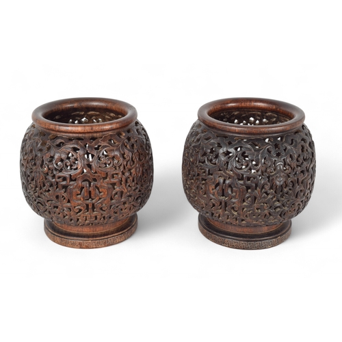 364 - Qing DynastyA pair of hongmu carved and pierced lanterns with inlaid metal basesDimensions:7.5 in. (... 