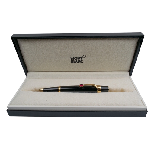 668A - MontblancSwissCirca 2000A black lacquer and gilt ballpoint penWith a synthetic ruby clipWith the ori... 