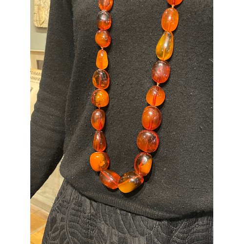 67 - Antique, ContinentalA superb and large natural Baltic amber necklace comprising 45 graduated ovoid-s... 