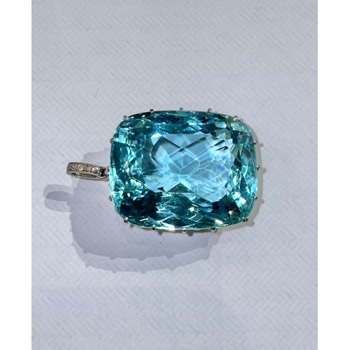 110 - Britishc. 1915A fine aquamarine and diamond pendantThe cushion shaped mixed cut aquamarine of fine b... 