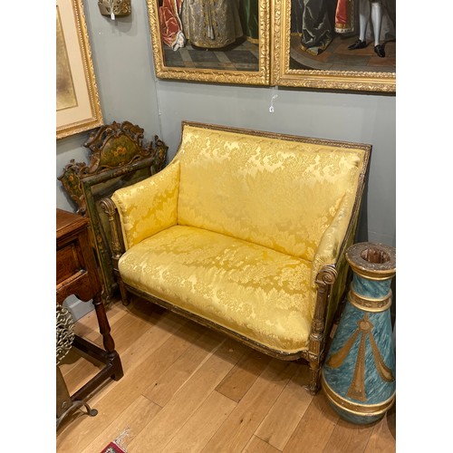 226 - Continental19th centuryA two seater setteeGiltwood, with yellow damask upholstery, on elegant fluted... 