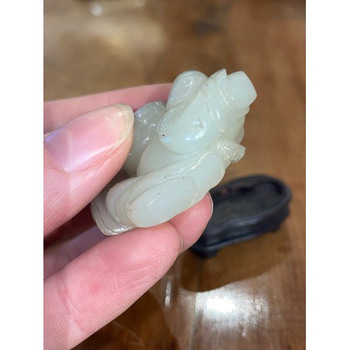 340 - Chinese19th CenturyWhitish mutton fat jade boy and carpProperty of a gentlemanFrom the collection of... 