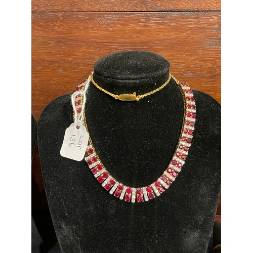 136 - Continental, Circa 1980s,An attractive ruby and diamond line fringe necklace.The front set with 64 s... 