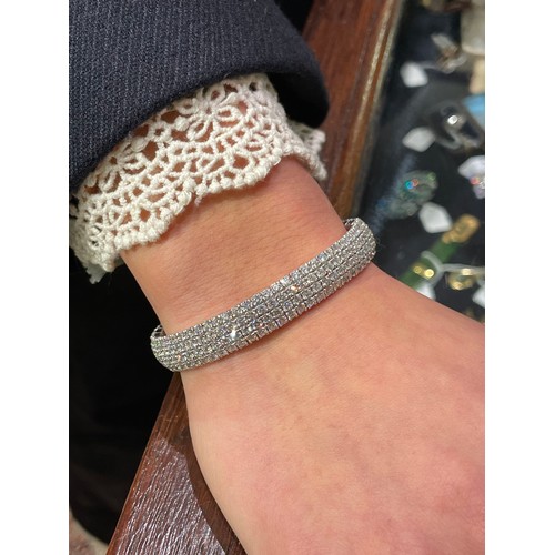 134 - Continental, ContemporaryAn 18 carat white gold pave set diamond cuff bangle.Set throughout with fou... 