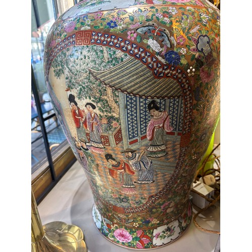 368 - Cantonese20th centuryA pair of famille rose large baluster urns. With birds, butterflies and floral ... 