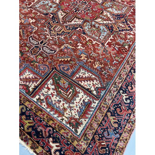 331 - PersianEarly 20th centurya Heriz carpetDimensions:330 cm (L) x 252 cm (W)... 