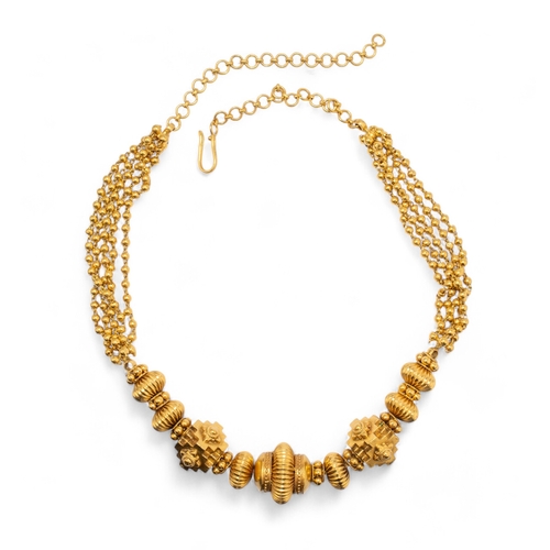 102 - Nemichand Bamalwa & Sons (J)A fine high carat yellow gold bead necklace. The front section set w... 