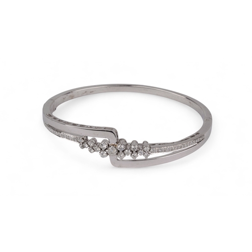 104 - ContemporaryA small diamond bangle set throughout with brilliant cut diamonds.Size: Approx. 5.5 cm. ... 