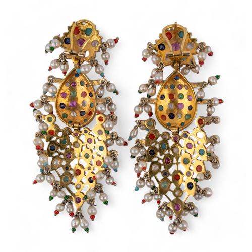 110 - Indian, circa 1960An impressive pair of multi gem set pendant earrings. Mounted in yellow metal.(One... 