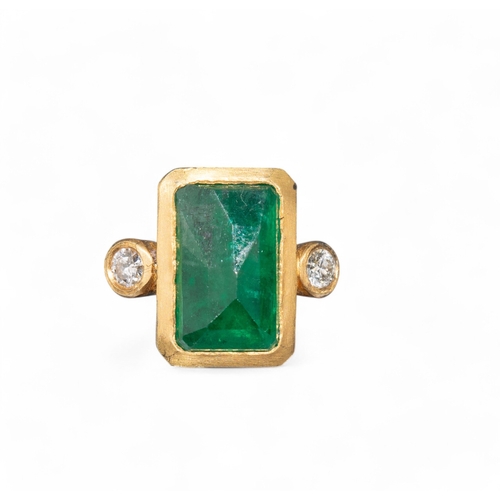 111 - Brooski, ContemporaryA rectangular cut emerald and diamond ring. The rectangular cut emerald with pa... 