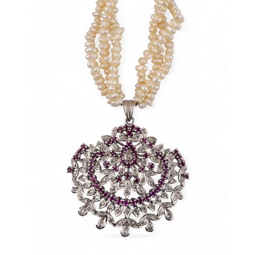 113 - Indian, circa 1980A diamond and ruby and fresh water pearl pendant necklaceLength: Approx. 44 cm.... 