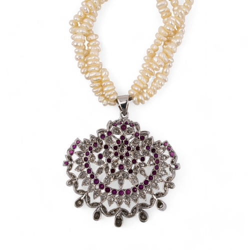 113 - Indian, circa 1980A diamond and ruby and fresh water pearl pendant necklaceLength: Approx. 44 cm.... 