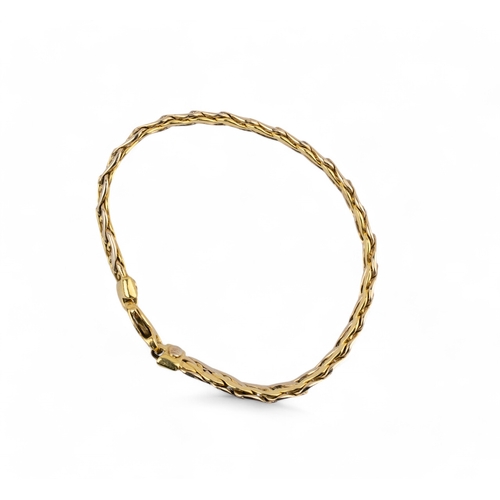 17 - Continental, 1980sA two tone 18 carat gold flattened curb link braceletWeight approx. 12.09 grams... 