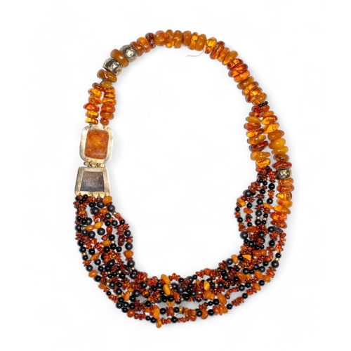 22 - Eileen Coyne, ContemporaryAn impressive mixed amber and hardwood and Blue John torsade necklace. The... 