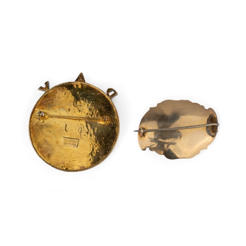 44 - Two brooches[a] A Salvador Dalí enamel and gilt metal brooch with surmounted by letters 'PAX'... 