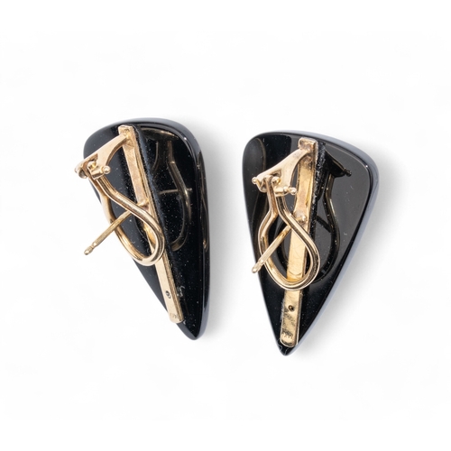 50 - Continental, Circa 1980sA pair of pear shaped mabe pearl gold and onyx ear clips.Total approx. weigh... 