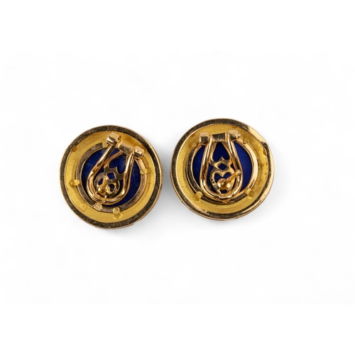 54 - ContinentalA high carat gold and lapis lazuli ear clips.Each earring centrally set with a circular c... 