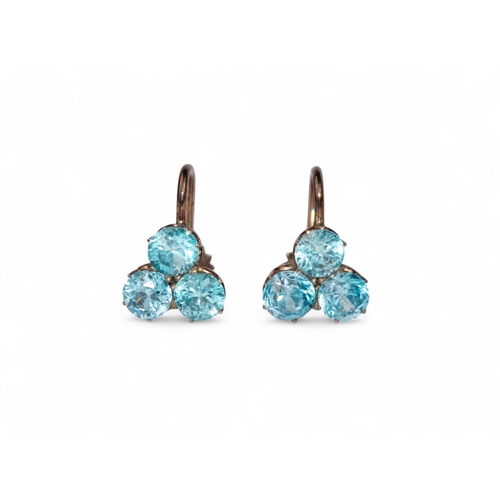 57 - AntiqueA pair of blue zircon and yellow gold trefoil cluster earrings.Total approx. weight: 2.66 g.... 