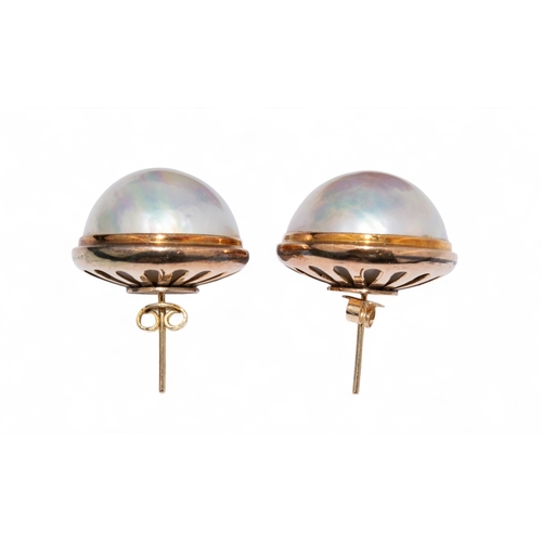 6 - Circa 1980sA large pair of mabe pearl and yellow gold earrings.The pearls with good iridescence and ... 