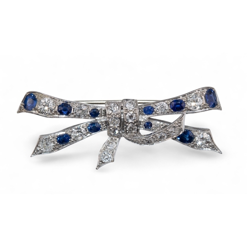 70 - Circa 1930A pretty sapphire and diamond bow brooch.Length:Approx. 5.9 cm. (W)Weight:Approx. 8.70 g.... 