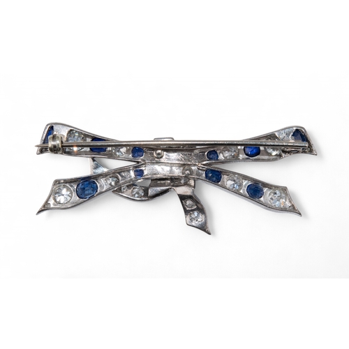 70 - Circa 1930A pretty sapphire and diamond bow brooch.Length:Approx. 5.9 cm. (W)Weight:Approx. 8.70 g.... 