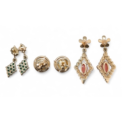 71 - 1990sThree pairs of gem set earrings.To include[a] A pair of 14 k gold and coral ear pendants[b] A p... 