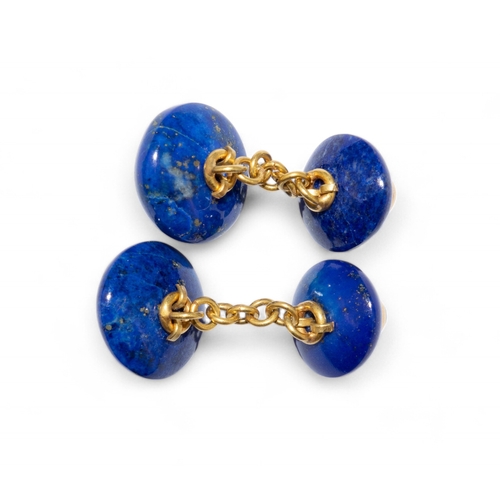 81 - A pair of lapis lazuli gold and emerald cufflinks.