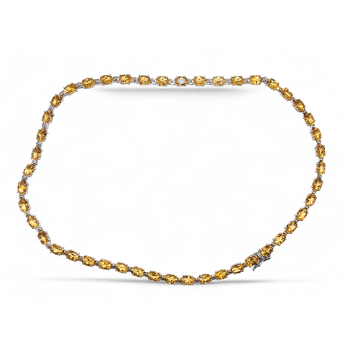 82 - ContemporaryA collet set citrine necklace, composed of forty-six uniform sized oval shaped mixed cut... 