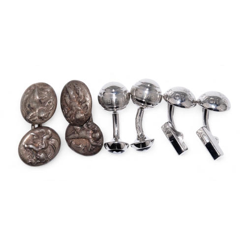 95 - Three pairs of silver cufflinks.To include:[a] An antique pair of putti cufflinks[b] A pair of Louis... 